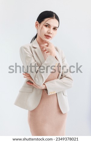 Portrait isolated cutout studio shot of Asian beautiful professional successful female businesswoman ceo entrepreneur in casual business wear standing smiling posing crossed arms on white background