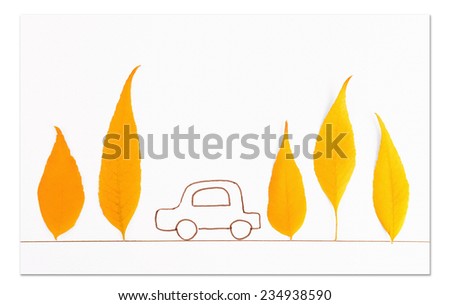 Autumn leaves with painted car isolated on white