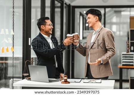 Two disgusting businessmen Asian lawyer of Indian descent paying attention to mistakes, proposing corrections. Businessman discussing contract policy terms with client, rights of liberty concept.