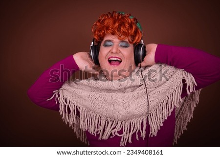 Funny Drag Queen listens to music, sings and watches scary movies.
