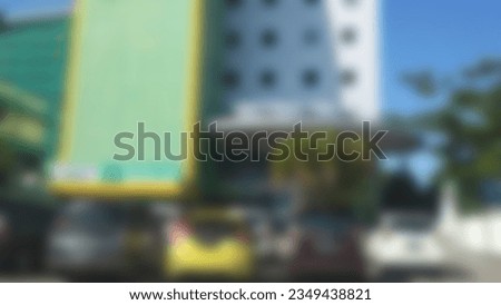 Blur photo Unfocused Exterior view of tower or menara UMI and Rektorat UMI taking from parking area