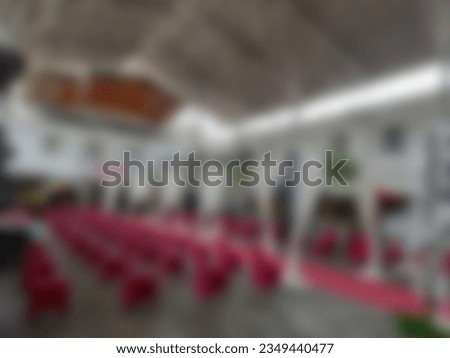 Blur photo Semi outdoor view for wedding venue with protocol covid 19 concept. Decorated red carpet with white flowers and curtains, and chairs set up