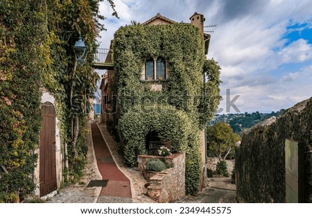 Traditional old stone house with jasmine vines where the French poet Jaques Prevert lived in the 1940s, medieval Saint Paul de Vence, South of France Royalty-Free Stock Photo #2349445575
