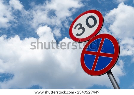 No parking and speed limit sign at cloudy sky