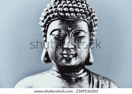 Meditating Buddha Statue on dark background. Close up. Copy space.                                                                                                                                     