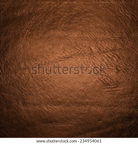 Background of orange leather texture. High resolution image. 