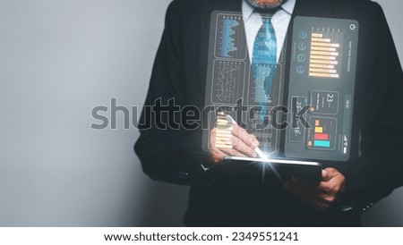 A businessman in a suit sits in his office, analyzing data on a virtual screen of his tablet, symbolizing the concept of using technology to enhance professional work.