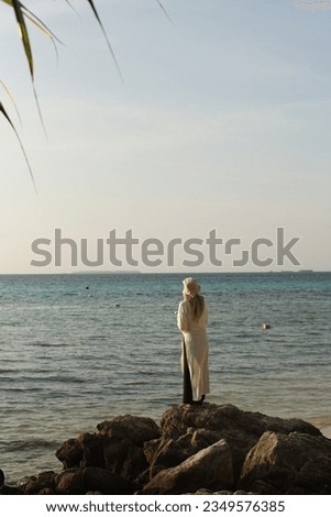 a girl enjoy the blue beach