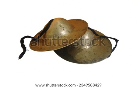 Cymbals: Percussion instruments made of metal alloys, producing crashing and shimmering sounds when struck. Royalty-Free Stock Photo #2349588429