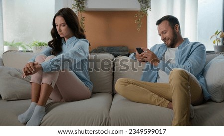 Family relationship problem man gadget addict guy social media phone addicted husband internet addiction smartphone boyfriend scrolling cellphone mobile app laughing offended woman wife dissatisfied Royalty-Free Stock Photo #2349599017
