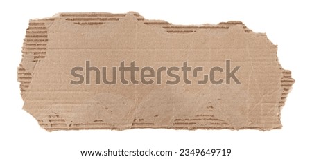 A piece of textured packaging cardboard. Piece of torn cardboard with copy space. Brown wrapping vintage paper, isolated top view. Kraft paper isolated on white background Royalty-Free Stock Photo #2349649719