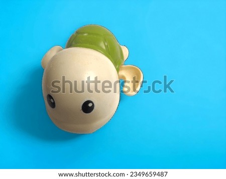 tortoise toy on a plain background