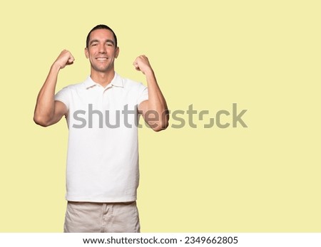 Happy young man doing a competitive gesture