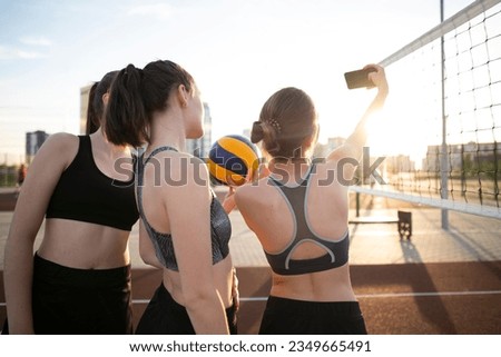 photo girls playing volleyball and taking selfie Royalty-Free Stock Photo #2349665491