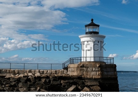Portland Breakwater Light, also known as Bug Light, was built on  the end of a stone breakwater to guide mariners into Portland Harbor in Maine Royalty-Free Stock Photo #2349670291