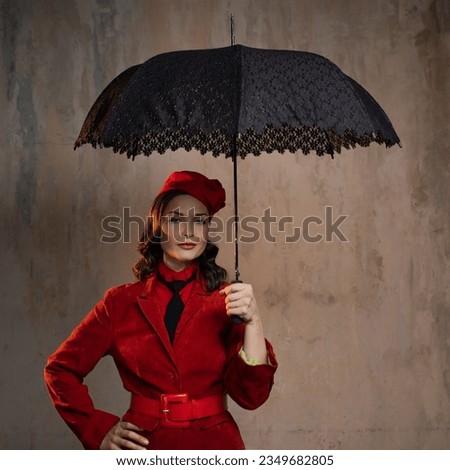 Mary Poppins. A stylish lady in a red old-fashioned suit with a hat and a lace umbrella Royalty-Free Stock Photo #2349682805