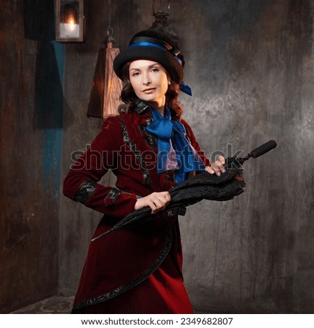 Mary Poppins. A stylish lady in a burgundy old - fashioned suit with a hat and a lace umbrella . Brunette in a retro style suit Royalty-Free Stock Photo #2349682807