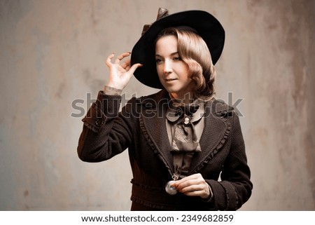 Stylish lady in an elegant suit in Victorian style, in a hat, close-up portrait Royalty-Free Stock Photo #2349682859