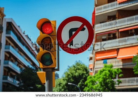 Traffic light and road sign do not turn right in European city Royalty-Free Stock Photo #2349686945