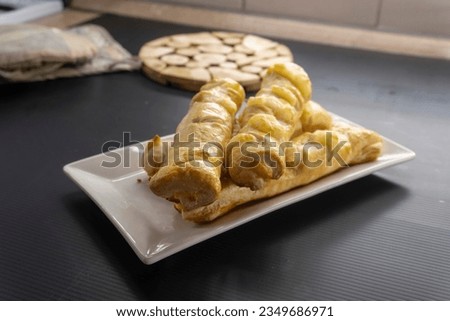 Puff pastry cheese sticks on black background.food concept. dessert. bakery.