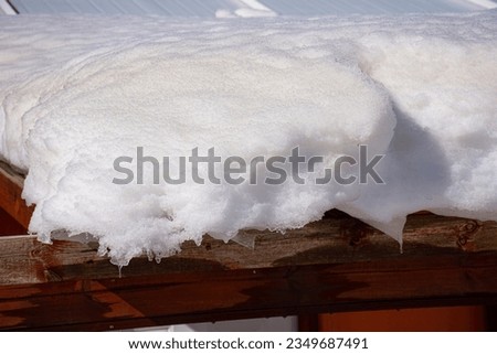 big snowdrift on the roof Royalty-Free Stock Photo #2349687491