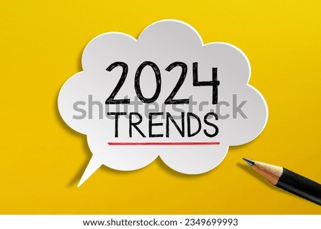 2024 Trends written on speech bubble with pencil on yellow background