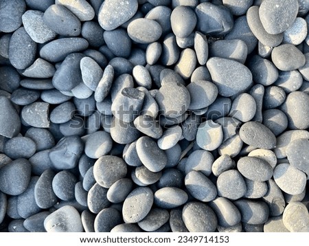 The background is made of large pebbles of gray color. The texture is made of gray pebbles. Pebbles for garden paths Royalty-Free Stock Photo #2349714153