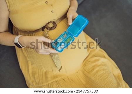 Prenatal Vitamins. Portrait Of Beautiful Smiling Pregnant Woman Holding Pill Box, Taking Supplements For Healthy Pregnancy While Sitting On Couch At Home, Free Space