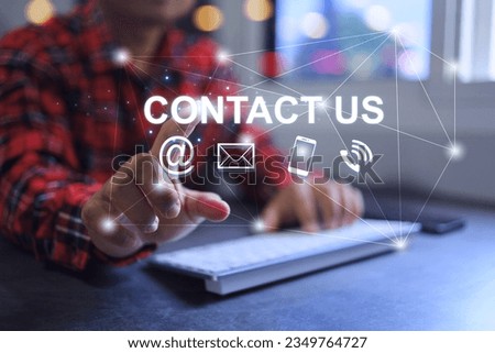 Contact us concept. Customer hand reach out touch on contact us word e mail social media chanel smart phone icon. Products information customer inquiry.