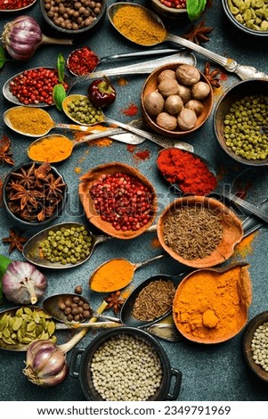 Variety of spices and herbs on kitchen table. Top view. Free space for text. Royalty-Free Stock Photo #2349791969