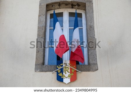 French flag and coat of arms text rf french republic of France in city hall facade red blue white colors