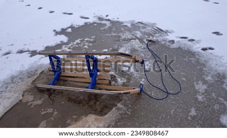 Wooden Sled on Thin Ice Lake, Danger of Drowning in Ice-Hole in Winter