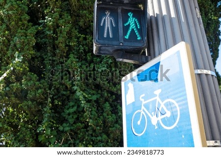A sign for pedestrian and a symbol of bicycle for cyclist to be allowed in bicycle area 
