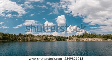 Cliff stone quarry lake in Krakow Zakrzowek. Spring pond landscape scenery, true pure Poland nature. A panorama picture of Zakrzowek Lake, in Krakow