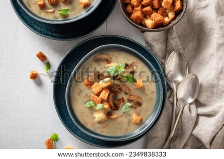 Homemade mushrooms soup with champignons and croutons. Creamy champignons soup with croutons. Royalty-Free Stock Photo #2349838333