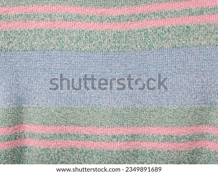 Soft colorful ribbed knitted fabric pattern close up as background