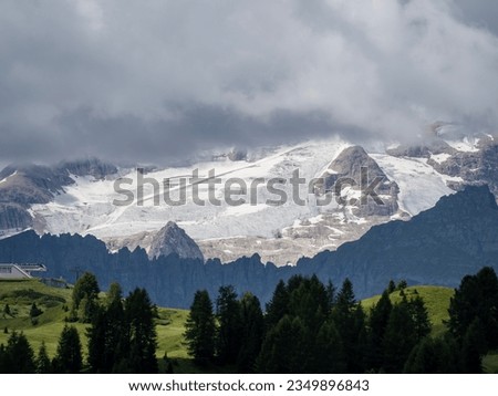 Amazing landscape to the Dolomiti and its glaciers during summer time. Melting of glaciers due to global warming. Global climate change. Italian alps