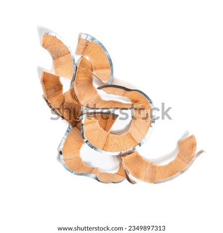 Wooden Eye pencil shavings isolated on white background. Silver Makeup pencil texture. Creative image of beauty products. Makeup or cosmetics design element. 