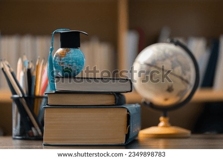 Graduation cap with Earth globe. Concept of global business study, abroad educational, Back to School. Education in Global world, Study abroad business in universities in worldwide. language study Royalty-Free Stock Photo #2349898783