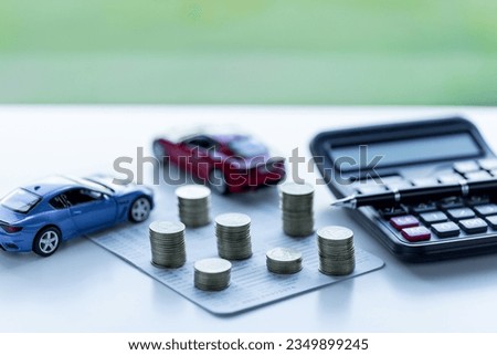 Car loan,money, banknote on agreement document or car insurance application form. Saving money for car concept, trade car for cash concept, finance concept. Royalty-Free Stock Photo #2349899245