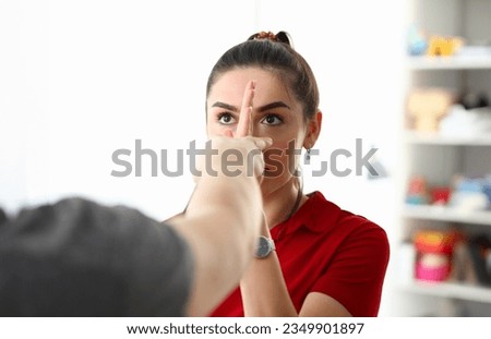 Pleasant girl does psychologists coordination test Royalty-Free Stock Photo #2349901897