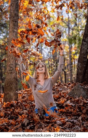 A gorgeous blonde model enjoys the outdoor fall weather