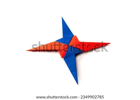 Origami paper star on a white background. diy. paper craft. 