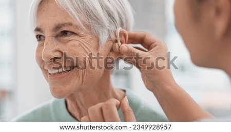 Old woman, doctor hands and patient with hearing aid, help and support with healthcare in clinic. Person with disability, deaf and people, trust and communication, health insurance and medical Royalty-Free Stock Photo #2349928957