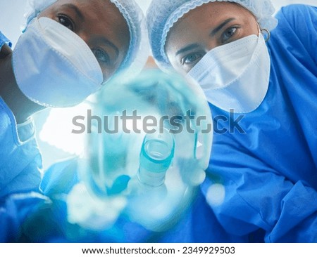 Surgery, anesthesia and doctors with oxygen mask for medical service, operation and procedure. Healthcare, hospital and portrait of surgeons with gas, breathing and ventilation equipment for patient Royalty-Free Stock Photo #2349929503