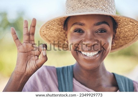 Smile, okay hand sign and portrait of black woman on farm with sustainable business, nature and sun. Agriculture, happy face and female farmer in Africa, green plants and yes emoji to agro farming