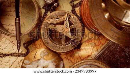 Vintage style travel and adventure. Vintage old compass and other vintage items on the table. Royalty-Free Stock Photo #2349933997