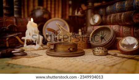 Vintage style travel and adventure. Vintage old compass and other vintage items on the table. Royalty-Free Stock Photo #2349934013