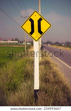  Yellow signs with symbols warn drivers of narrow bridge traffic sign  