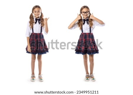 Girl schoolgirl in full growth age 9 years. Two figures of the same model isolated on white. The first points to the side, the second raises her thumbs up. Royalty-Free Stock Photo #2349951211